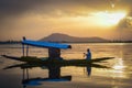 A wooden boat in Dal Lake, Srinagar, Kashmir on a beautiful sunset evening Royalty Free Stock Photo