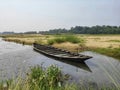 a wooden boat damped on the river side Royalty Free Stock Photo