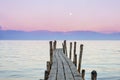 Wooden boat dock with the sunset sky on the background in Lake Atitlan, Guatemala Royalty Free Stock Photo