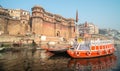 Colorful wooden boats docked along the shore of the Ganges River, at one of the many ghats in Varanasi, India. Royalty Free Stock Photo