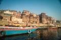 Colorful wooden boats docked along the shore of the Ganges River, at one of the many ghats in Varanasi, India. Royalty Free Stock Photo