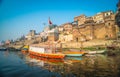 Colorful wooden boats docked along the shore of the Ganges River, at one of the many ghats in Varanasi, India. Royalty Free Stock Photo