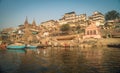 Colorful wooden boats docked along the shore of the Ganges River, at one of the many ghats in Varanasi, India. Royalty Free Stock Photo