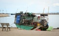 A wooden boat docking at Dinh cau pier in Phu Quoc, Vietnam