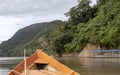 Wooden boat front and green jungle landscape, sailing in the muddy water of the Beni river, Amazonian rainforest, Bolivia Royalty Free Stock Photo