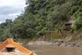 Wooden boat front and green jungle landscape, sailing in the muddy water of the Beni river, Amazonian rainforest, Bolivia Royalty Free Stock Photo