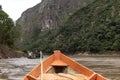 Wooden boat front and green jungle landscape, sailing in the muddy water of the Beni river, Amazonian rainforest, Bolivia Royalty Free Stock Photo