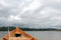 Wooden boat front and green jungle landscape, sailing in the muddy water of the Beni river, Amazonian rainforest, Bolivia Royalty Free Stock Photo