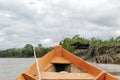 Wooden boat front and green jungle landscape, sailing in the muddy water of the Beni river, Amazonian rainforest, Bolivia Royalty Free Stock Photo