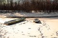 Wooden boat on a frozen river in a Russian village Royalty Free Stock Photo