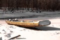 Wooden boat on a frozen river in a Russian village Royalty Free Stock Photo
