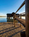 a wooden boat house at a lake in southern Germany at sunset with blue sky Royalty Free Stock Photo