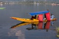 Wooden boat and indian people in lake. Srinagar, India Royalty Free Stock Photo