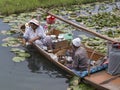 Wooden boat and indian people in lake. Srinagar, India Royalty Free Stock Photo