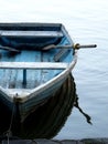 Wooden boat and its reflection