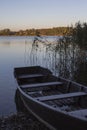 A wooden boat on the lake in the city of Trakai in the morning. Lithuania Royalty Free Stock Photo