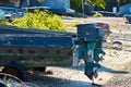 A wooden boat with a motor is parked on land. The old boat is on the rocks. Wooden motor boat. The old boat is on the shore. Royalty Free Stock Photo