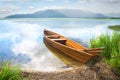 Wooden boat on the mountain lake Royalty Free Stock Photo