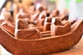 Wooden boat and oarsmen sculptures