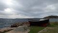 A wooden boat on the ocean coast in southern Sweden Royalty Free Stock Photo