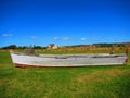 Wooden boat onshore with a lobster trap Royalty Free Stock Photo