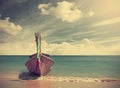 Wooden boat on pristine beach. Royalty Free Stock Photo