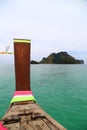 A view from the wooden pubis with ribbons in the sea with a view of the island