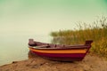 Wooden boat on the river bank Royalty Free Stock Photo