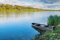 Wooden boat on the river bank Royalty Free Stock Photo