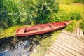 Fisherman`s wooden boat near the lake shore Royalty Free Stock Photo