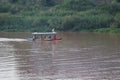 A wooden boat sailing in the Chao Phraya River, Nakhon Sawan Province, Thailand