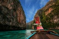 Wooden boat at the Thai Islands. Old wooden boat on Asian Islands. Thai Phi Phi Islands. Boat in the Bay. Travelling to Asia.