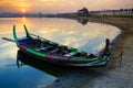 Wooden boat in Ubein Bridge at sunrise, Mandalay, Myanmar Royalty Free Stock Photo