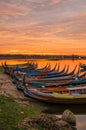 Wooden boat in Ubein Bridge at sunrise, Mandalay, Myanmar.