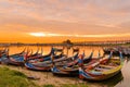 Wooden boat in Ubein Bridge at sunrise, Mandalay, Myanmar.