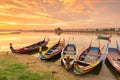 Wooden boat in Ubein Bridge at sunrise, Mandalay, Myanmar . Royalty Free Stock Photo