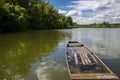 Wooden boat and the view of the backwater of Tisza