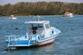 Wooden boats anchored in connection channel with the sea Royalty Free Stock Photo