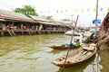 Wooden boats busy ferrying people at Amphawa floating market