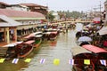 Wooden boats busy ferrying people at Amphawa floating market