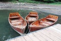 Wooden boats chained to the dock