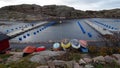 Wooden boats on the fishing harbor on the ocean coast in southern Sweden Royalty Free Stock Photo