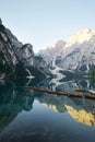 Wooden boats on Lake Braies, Dolomites, Italy. Reflection of mountains Royalty Free Stock Photo