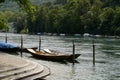 Wooden boats moored at promenade along Rhine river in Schaffhausen, Switzerland. Royalty Free Stock Photo