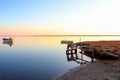 wooden boats sailing on the river in a fishing village from an old pier at sunset Royalty Free Stock Photo