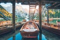 Wooden boats under the house in famous Braies lake at sunrise Royalty Free Stock Photo