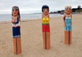 Wooden bollard sculptures of swimming-girls in Geelong along the baywalk. All made by Jan Mitchell and represent a chronicle of th