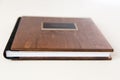 Wooden book with metal shild Royalty Free Stock Photo