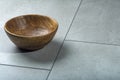Wooden bowl on a concrete stone surface. Texture and texture of wood and concrete Royalty Free Stock Photo