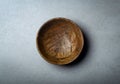 Wooden bowl on a concrete stone surface. Texture and texture of wood and concrete Royalty Free Stock Photo